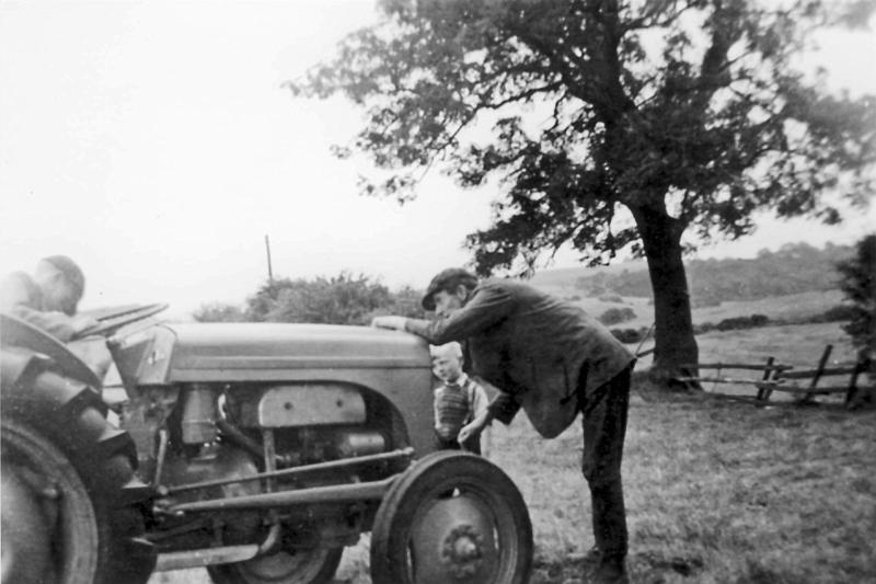 Tractor at Cowber c1954.JPG - Tractor at Cowber c 1954,  with Robert Mellin in driving seat, William Henry Mellin on starting handle and Frank Mellin behind.